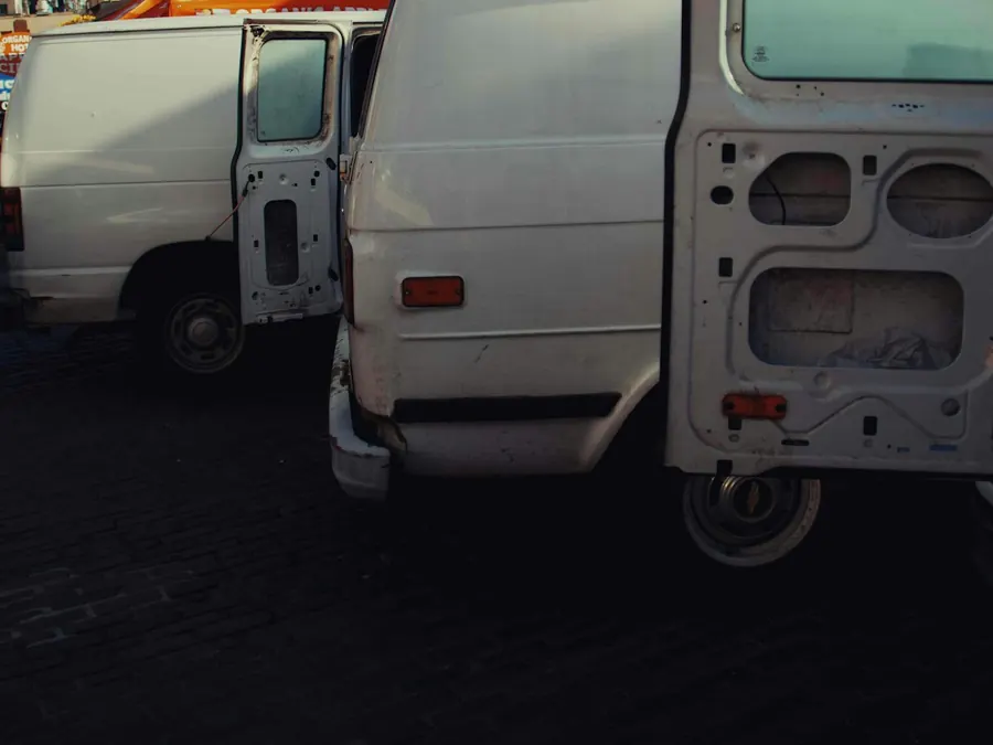Two white vans parked up